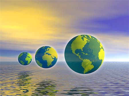 Trois Globes affichant les Continents du monde, en vol stationnaire au-dessus de l'eau Photographie de stock - Rights-Managed, Code: 700-00035739