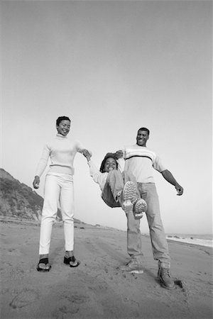 simsearch:700-00036865,k - Mother and Father Swinging Daughter by Arms on Beach Stock Photo - Rights-Managed, Code: 700-00035836