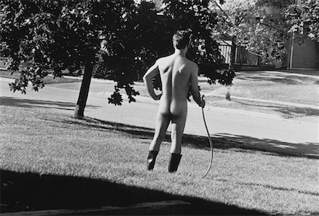 exhibitionist - Back View of Nude Man Watering Lawn Stock Photo - Rights-Managed, Code: 700-00036148