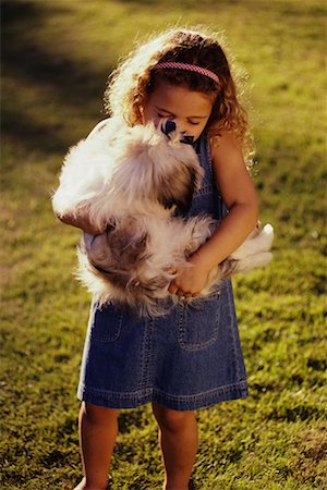 simsearch:700-00814363,k - Girl Standing in Field, Holding Dog Foto de stock - Con derechos protegidos, Código: 700-00036921