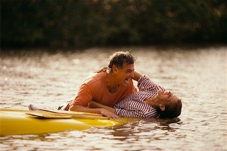Couple and Overturned Canoe Stock Photo - Rights-Managed, Code: 700-00037117