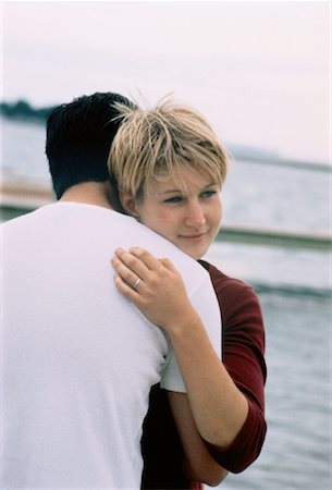 Couple Embracing by Water Stock Photo - Rights-Managed, Code: 700-00037247