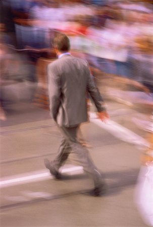 simsearch:700-06325341,k - Back View of Businessman Walking Outdoors Stock Photo - Rights-Managed, Code: 700-00037253