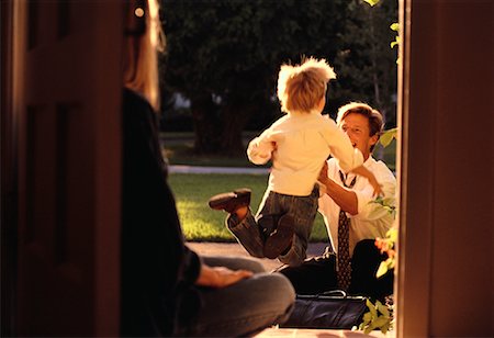 excited happy family and jumping and home - Parents and Child at Doorway Stock Photo - Rights-Managed, Code: 700-00037316
