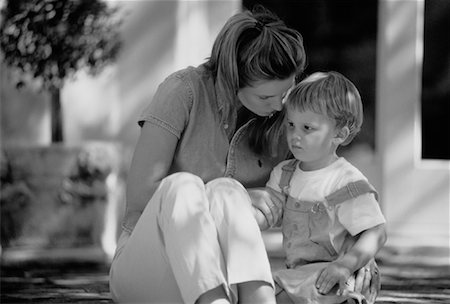 sad boy in black and white - Mother and Son Outdoors Stock Photo - Rights-Managed, Code: 700-00037372