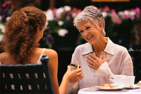 ethnic family at restaurant - Women Exchanging Gifts at Outdoor Cafe Stock Photo - Rights-Managed, Code: 700-00037798