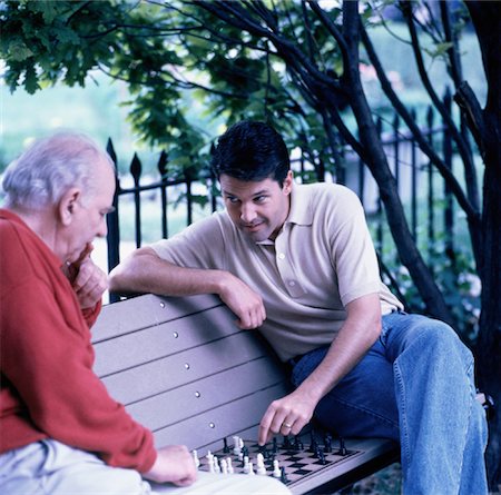 senior man introspective - Mature Father and Son Playing Chess Outdoors Foto de stock - Con derechos protegidos, Código: 700-00037935