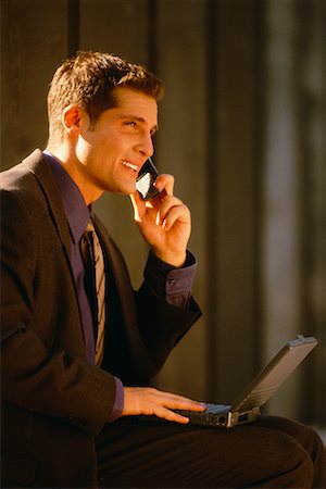 simsearch:700-00043555,k - Businessman Using Cell Phone And Laptop Computer Stock Photo - Rights-Managed, Code: 700-00038003