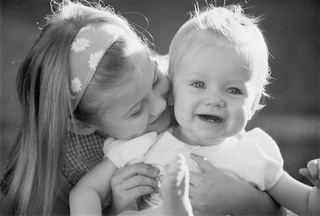 sister hugs baby - Girl Holding Baby Stock Photo - Rights-Managed, Code: 700-00038168