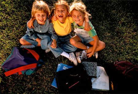 Girls Sitting Outdoors with Backpacks and Notebooks Stock Photo - Rights-Managed, Code: 700-00038176