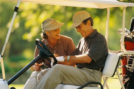 Mature Couple in Golf Cart Foto de stock - Direito Controlado, Número: 700-00038193