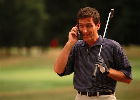Male Golfer Using Cell Phone Stock Photo - Rights-Managed, Code: 700-00038566