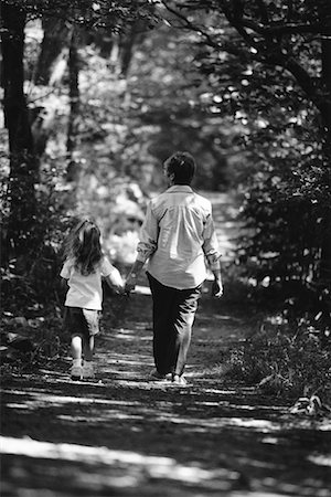 Back View of Grandmother and Granddaughter Walking Outdoors Foto de stock - Con derechos protegidos, Código: 700-00038593