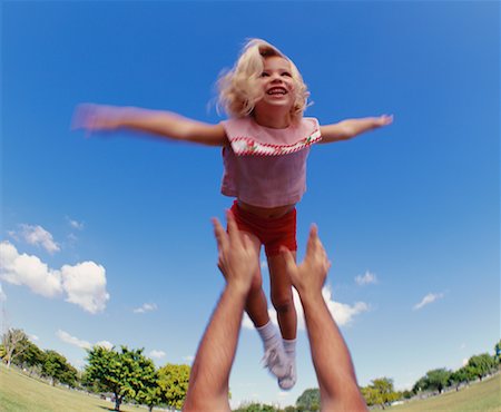 Father Throwing Daughter in Air Stock Photo - Rights-Managed, Code: 700-00038609