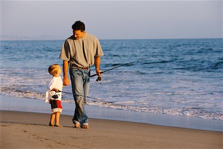 father son caucasian walking two people casual clothing - Father and Son Walking on Beach Stock Photo - Rights-Managed, Code: 700-00038789