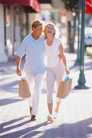 simsearch:700-00090323,k - Couple Walking Outdoors with Shopping Bags Stock Photo - Rights-Managed, Code: 700-00039575