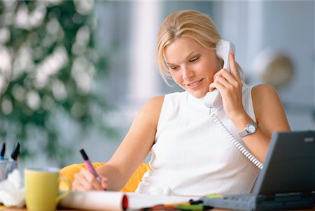 Businesswoman Sitting at Desk Using Phone, Writing in Journal Foto de stock - Con derechos protegidos, Código: 700-00030021