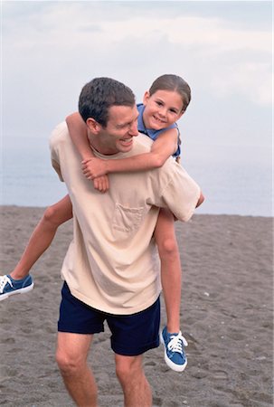piggyback daughter at beach - Father Holding Daughter at the Beach Stock Photo - Rights-Managed, Code: 700-00030174