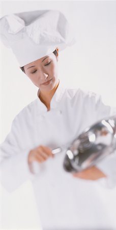 Female Chef Using Mixing Bowl Stock Photo - Rights-Managed, Code: 700-00030389