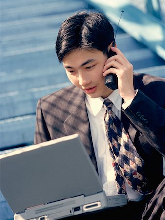 simsearch:700-00035291,k - Businessman Sitting on Steps Using Laptop and Cell Phone Foto de stock - Direito Controlado, Número: 700-00030690