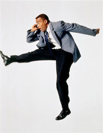 simsearch:700-00049474,k - Businessman Jumping, Using Cell Phone Stock Photo - Rights-Managed, Code: 700-00030801