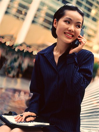 Businesswoman Using Cell Phone Outdoors Stock Photo - Rights-Managed, Code: 700-00030992