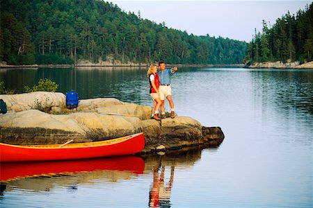 Couple Canoeing Temagami, Ontario, Canada Foto de stock - Con derechos protegidos, Código: 700-00031156