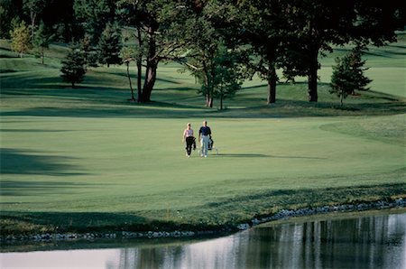 richmond hill - Mature Couple Golfing Richmond Hill, Ontario, Canada Foto de stock - Direito Controlado, Número: 700-00031165