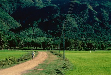 simsearch:700-00554819,k - Woman Riding Bicycle on Dirt Road Nha Trang, Vietnam Stock Photo - Rights-Managed, Code: 700-00031567