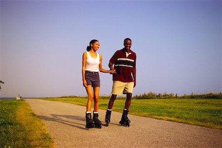 Couple In-Line Skating, Holding Hands Stock Photo - Rights-Managed, Code: 700-00031595