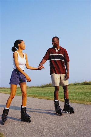 Couple In-Line Skating, Holding Hands Stock Photo - Rights-Managed, Code: 700-00031952