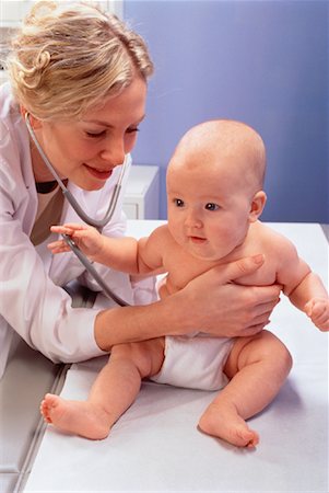 stethoscope girl and boy - Pediatrician Examining Infant Foto de stock - Con derechos protegidos, Código: 700-00032092