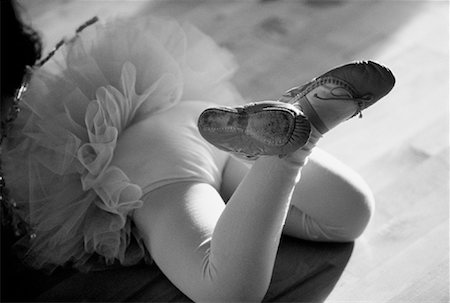 Child Wearing Ballet Slippers Lying on Floor Stock Photo - Rights-Managed, Code: 700-00032169