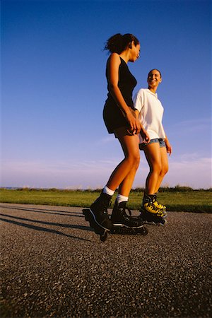Femmes patin à roues alignées Photographie de stock - Rights-Managed, Code: 700-00032304