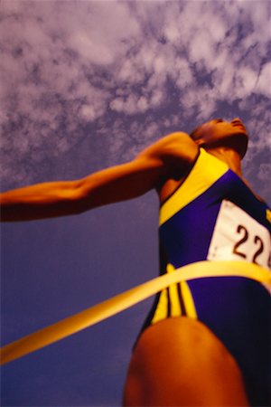 Woman Crossing Finish Line Stock Photo - Rights-Managed, Code: 700-00032556