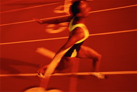 runners crossing the finish line - Blurred View of Runner Crossing Finish Line Stock Photo - Rights-Managed, Code: 700-00032747