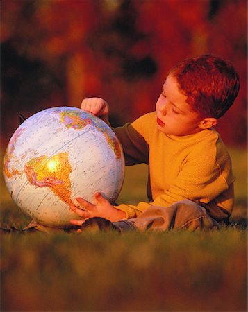 Boy with Globe Outdoors Stock Photo - Rights-Managed, Code: 700-00032984