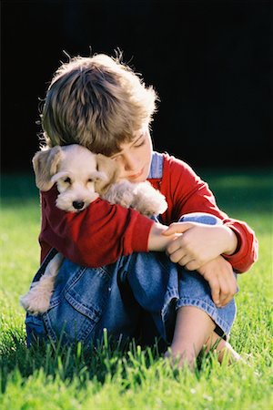 simsearch:700-03644589,k - Boy with Puppy Outdoors Foto de stock - Con derechos protegidos, Código: 700-00033035
