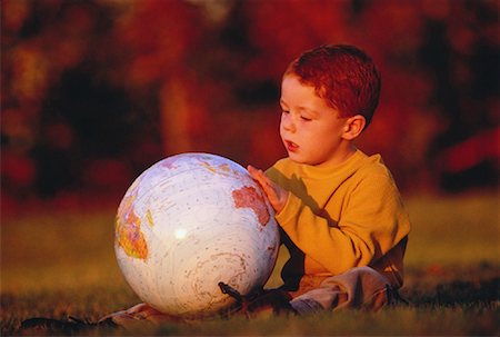 Boy with Globe Outdoors South Pacific Stock Photo - Rights-Managed, Code: 700-00033033