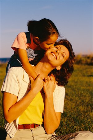 peter griffith - Daughter Kissing Mother Outdoors Stock Photo - Rights-Managed, Code: 700-00033174