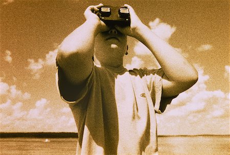 Boy Looking Through Stereoscope Outdoors Stock Photo - Rights-Managed, Code: 700-00033264