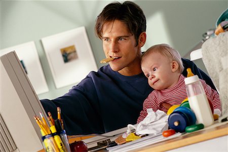 Father Holding Toddler While Using Computer Stock Photo - Rights-Managed, Code: 700-00033337
