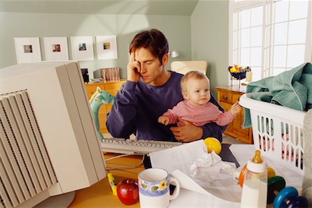 Father Holding Toddler While Working on Computer Foto de stock - Con derechos protegidos, Código: 700-00033338