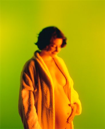pregnancy nude - Portrait of Nude Pregnant Woman In Bathrobe Foto de stock - Con derechos protegidos, Código: 700-00033366