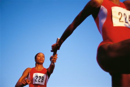 Woman Passing Baton Stock Photo - Rights-Managed, Code: 700-00033490