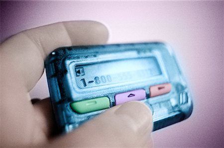 pager - Close-Up of Hand Holding Pager Stock Photo - Rights-Managed, Code: 700-00044019