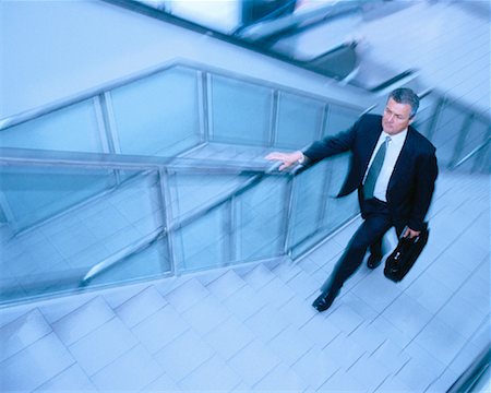 simsearch:700-00823632,k - Businessman with Briefcase Walking up Stairs Stock Photo - Rights-Managed, Code: 700-00044023