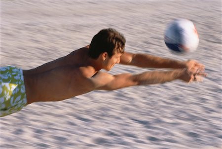 diving (not water) - Man Playing Volleyball on Beach Foto de stock - Con derechos protegidos, Código: 700-00044074