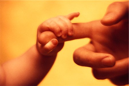 simsearch:700-00038183,k - Adult and Baby's Hands Foto de stock - Con derechos protegidos, Código: 700-00044513