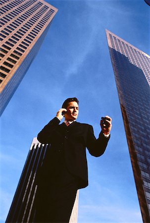 pager - Businessman Using Cell Phone and Pager Outdoors Stock Photo - Rights-Managed, Code: 700-00044589